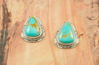 Genuine Manassa Turquoise set in Sterling Silver Post Earrings. This Turquoise is also referred to as King�s Manassa Turquoise. The Manassa Turquoise mine is located in Manassa, Conejos County, Colorado. Created by Navajo Artist Lucy Valencia. Signed LJ.
